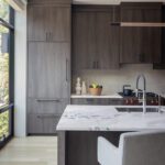 Contemporary kitchen cabinetry made from stained, wire-brushed oak