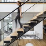 Modern stairs in a home designed by Darien Fortier