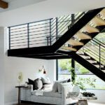 Grand contemporary staircase with a reading nook underneath