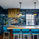 Kitchen with bright blue cabinets and tile