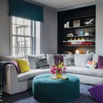 Seating area with a large sectional couch and grasscloth wallcovering