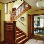 Entry to a historic home with dark woodwork