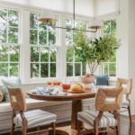 Dining area with an oval dining table rattan chairs