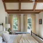 Primary bedroom with a vaulted ceiling