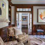 Cozy den with wood trim and brown and white patterned arm chairs