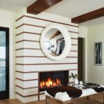 Sophisticated living space featuring a horizontal-striped fireplace with a round mirror, cozy flames, and modern decor accents.