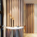 Serene foyer with natural textures, soft lighting, and minimalist decor for a welcoming and peaceful entryway.
