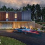 Striking modern home exterior featuring wood and concrete materials, with a sleek driveway surrounded by forest.