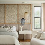 Tranquil bedroom suite with plush bedding, modern pendant lighting, and soft neutral textures in a coastal-inspired palette.