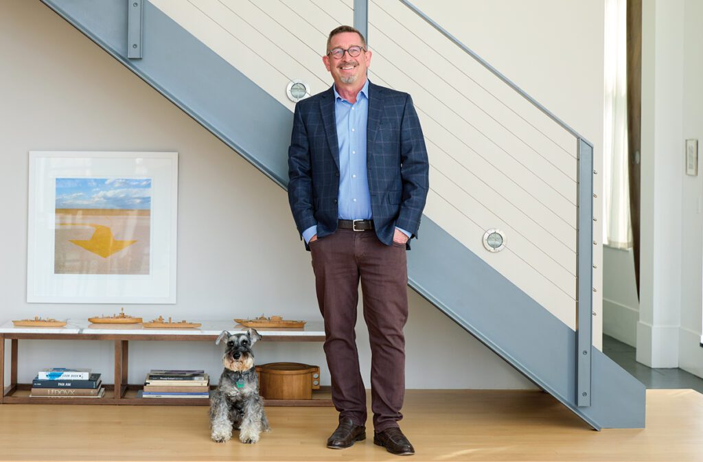 David Hacin at his Boston home with his dog
