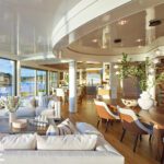 Sunlit great room with floor-to-ceiling windows and modern furnishings