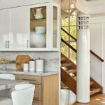 Sculptural wood staircase and curved architectural column