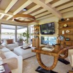 Home office with fireplace, built-ins, and plush seating