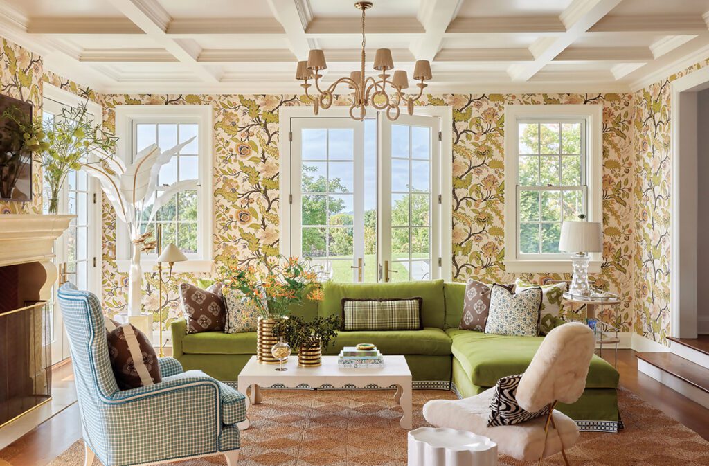 Pattern-filled living room with floral wallpaper and coffered ceiling