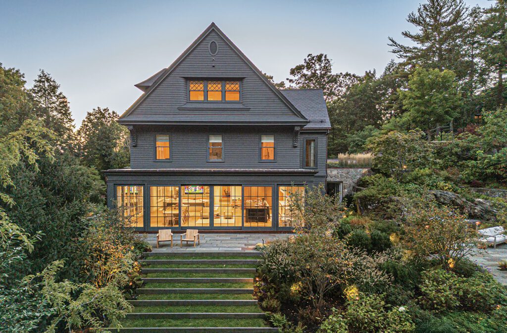 Rear exterior of a home at twilight