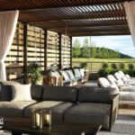 Covered outdoor lounge with wood slatted ceiling, daybeds, and cozy sectional seating.