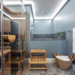Luxury spa bathroom with sauna, Japanese soaking tub, and pebble floors