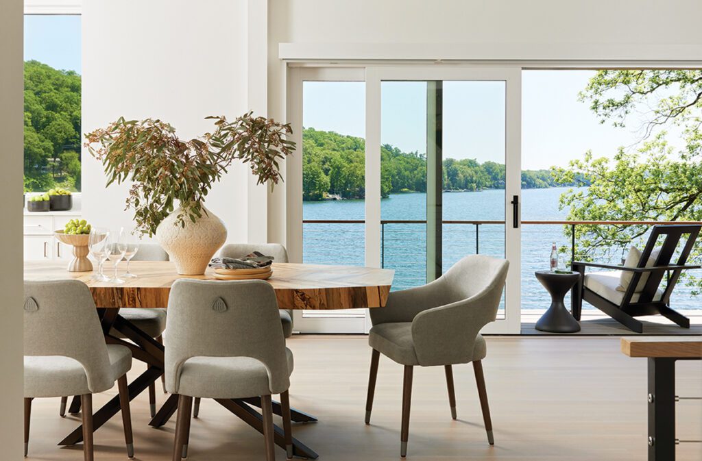 Contemporary living room with sectional sofa, modern art, and marble fireplace wall.