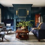 Elegant living room with high-gloss navy paneling and patterned blue seating