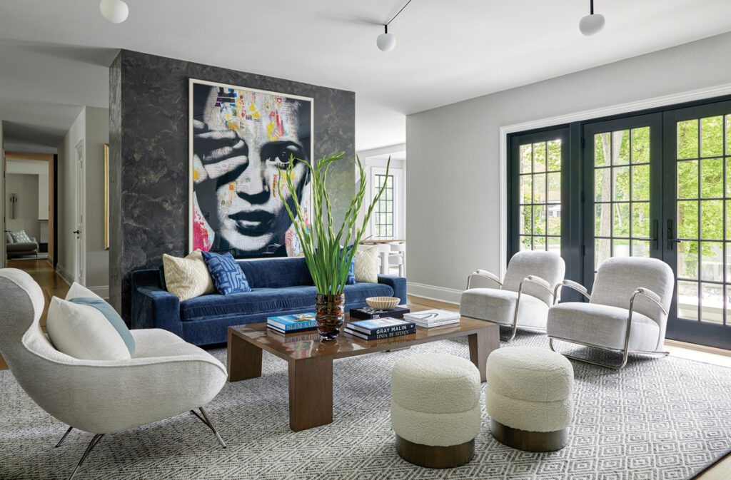 Living room with contemporary seating, bold artwork, and French doors