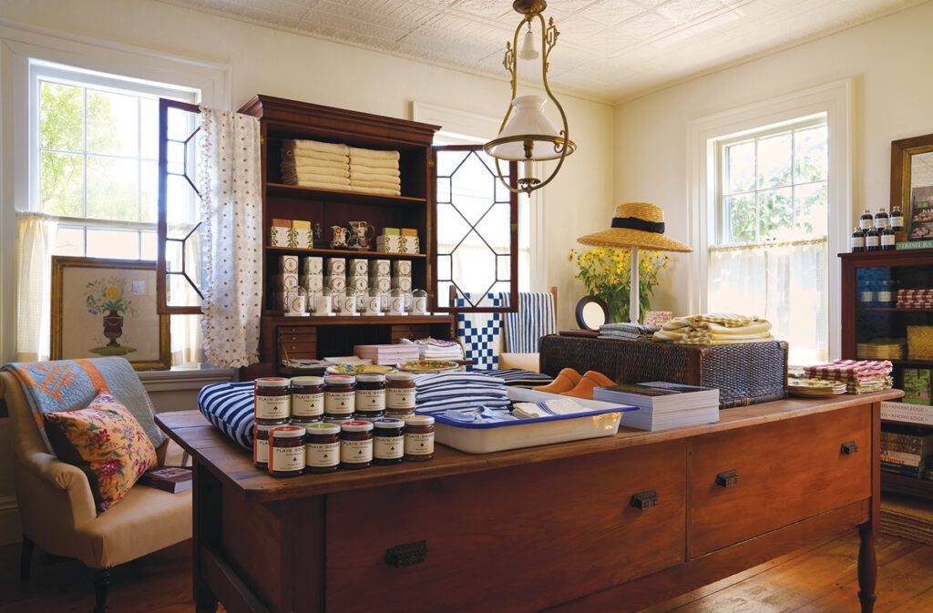 Plain Goods store interior with vintage furniture, home goods, and textiles.