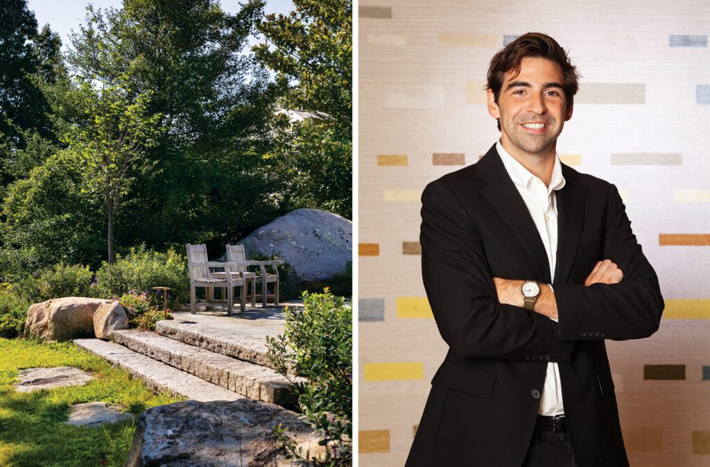 Landscape Architect Dennis Staton wearing a black jacket and standing in front of a neutral abstract rug design.